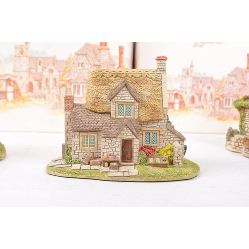 360 - Lilliput Lane - A collection of late 20th century house / cottage resin figurines / ornaments. To in... 