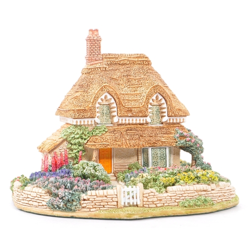 361 - Lilliput Lane - A collection of late 20th century house / cottage resin figurines / ornaments. To in... 