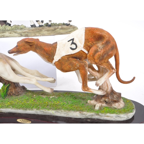 363 - The Juliana Collection - A 20th Century Juliana Collection resin figure in the form of two greyhound... 