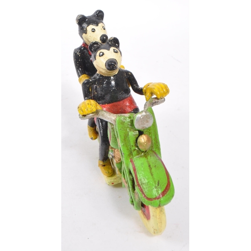 365 - An early - mid Century painted cast iron figurine in the form of Walt Disney's Mickey and Minnie mou... 