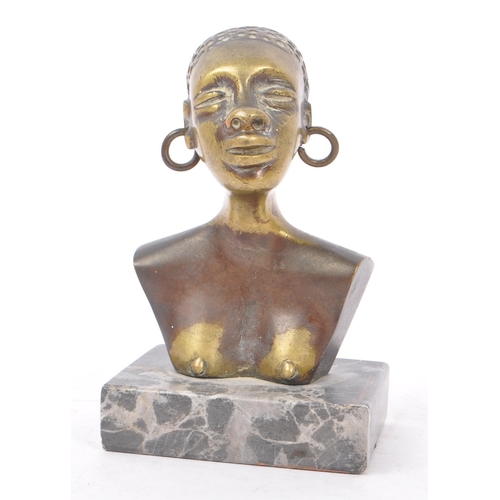 368 - A 20th Century painted African bronze bust figure depicting a woman with large hooped earrings upon ... 