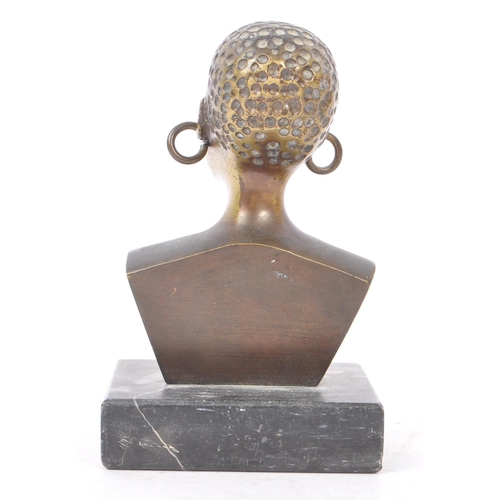 368 - A 20th Century painted African bronze bust figure depicting a woman with large hooped earrings upon ... 