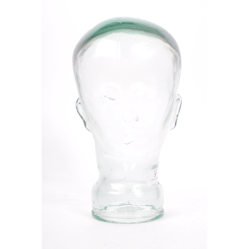 37 - A 20th Century vintage clear glass millinery mannequin pressed head having moulded features. Measuri... 