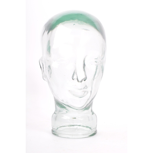 37 - A 20th Century vintage clear glass millinery mannequin pressed head having moulded features. Measuri... 