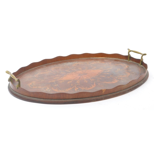 372 - A large early 20th Century mahogany butlers / serving tray having boxwood inlaid marquetry design to... 