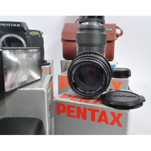 386 - Pentax - A circa 1980s boxed Pentax SFX 35mm AF SLR camera, with a boxed Pentax Zoom 70-X and a coll... 