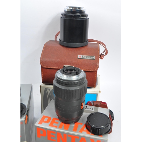 386 - Pentax - A circa 1980s boxed Pentax SFX 35mm AF SLR camera, with a boxed Pentax Zoom 70-X and a coll... 