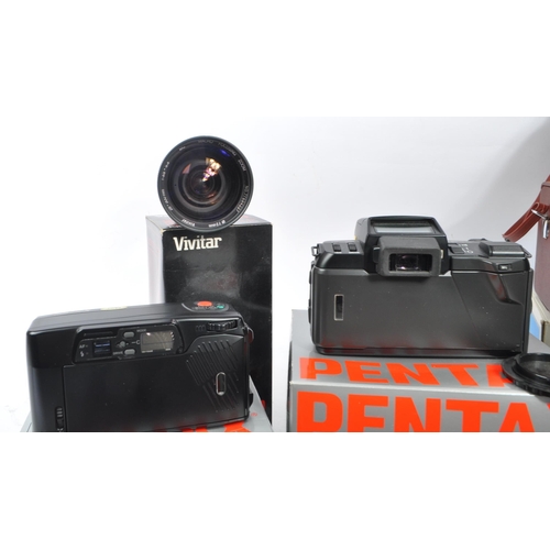 386 - Pentax - A circa 1980s boxed Pentax SFX 35mm AF SLR camera, with a boxed Pentax Zoom 70-X and a coll... 