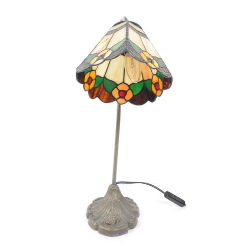 389 - A vintage Art Nouveau style Tiffany table lamp light. Stain glass style with lead shade, curved meta... 