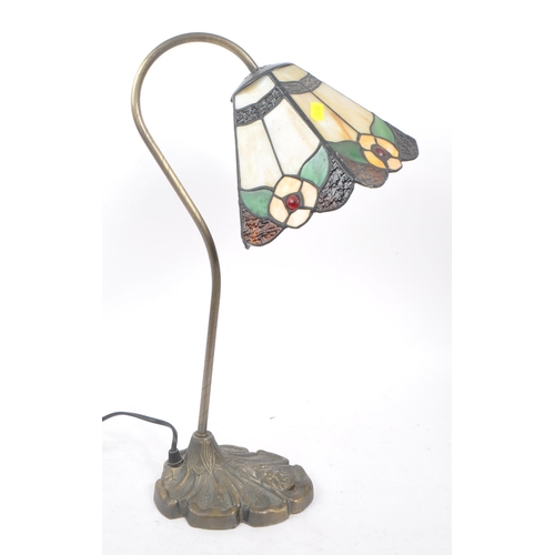 389 - A vintage Art Nouveau style Tiffany table lamp light. Stain glass style with lead shade, curved meta... 