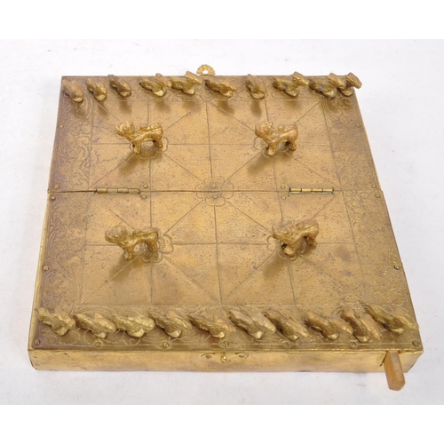 393 - A 20th century Nepalese brass Bagh Chal board game having original tiger / goat game tokens pieces u... 