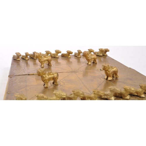 393 - A 20th century Nepalese brass Bagh Chal board game having original tiger / goat game tokens pieces u... 