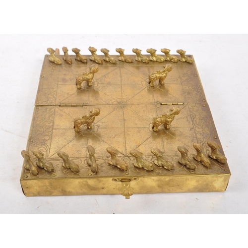 393 - A 20th century Nepalese brass Bagh Chal board game having original tiger / goat game tokens pieces u... 