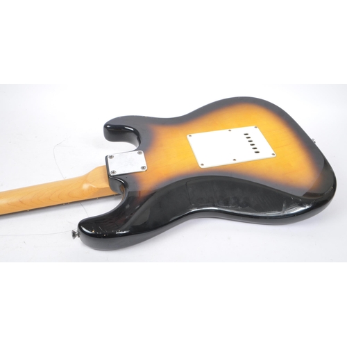 409 - Tanglewood - A 20th Century Stratocaster style left handed electric guitar having sunburst finish an... 