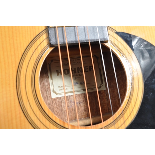 413 - Hohner - An acoustic Hohner guitar model no. MW - 300 with black scratch plate. Measuring approximat... 