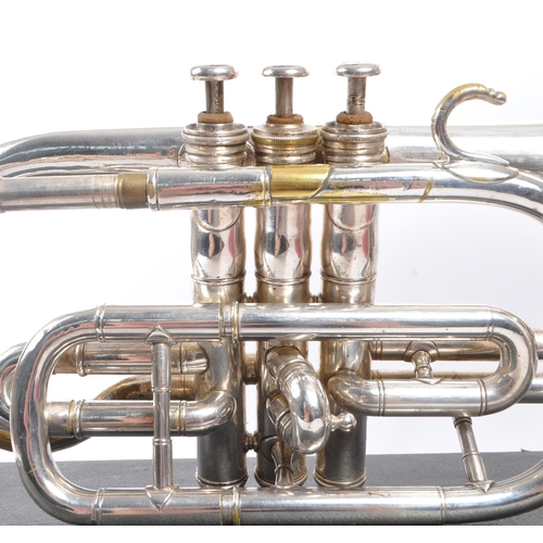 420 - Boosey & Co. - An early 20th century Boosey & Co light valve cornet. The cornet in silver tone white... 