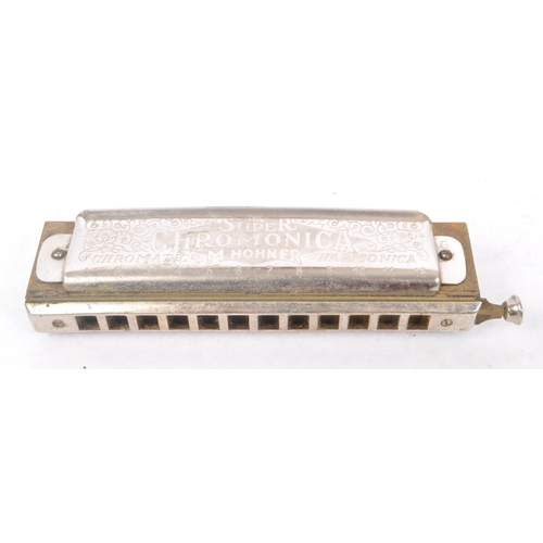 424 - M. Hohner - An early 20th Century German ' Super Chromonica Chromatic Harmonica ' by M. Hohner held ... 