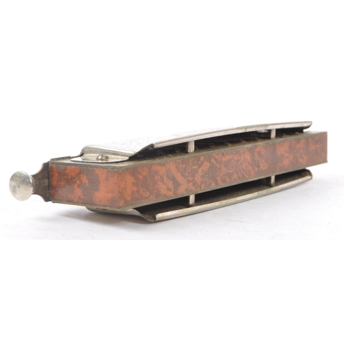 424 - M. Hohner - An early 20th Century German ' Super Chromonica Chromatic Harmonica ' by M. Hohner held ... 