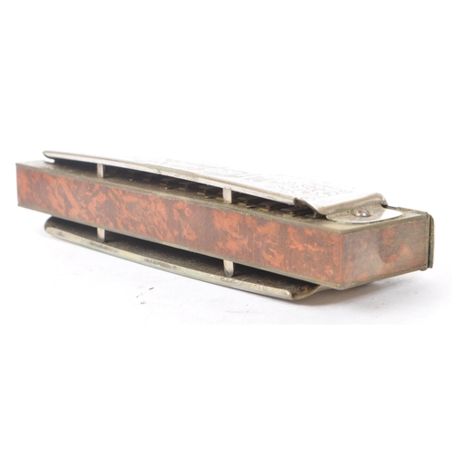 424 - M. Hohner - An early 20th Century German ' Super Chromonica Chromatic Harmonica ' by M. Hohner held ... 