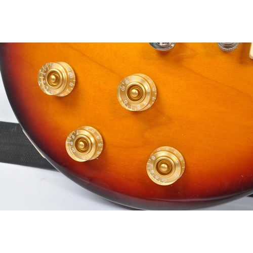 425 - Epiphone - Les Paul - A Epiphone Les Paul 100 electric guitar. The guitar having a tobacco sunburst ... 