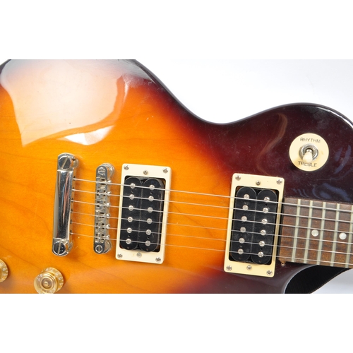 425 - Epiphone - Les Paul - A Epiphone Les Paul 100 electric guitar. The guitar having a tobacco sunburst ... 