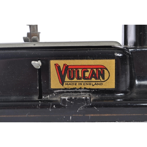 445 - Volcan - Mid 20th century toy tin sewing machine. Made in England with label to side. Black colour w... 