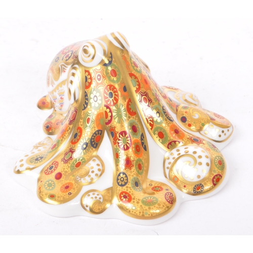 45 - Royal Crown Derby - A bone china Royal Crown Derby gold signature octopus paperweight with gold stop... 