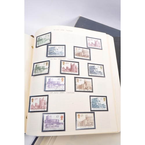 461 - A collection of 20th and 21st Century UK franked and unfranked commemorative stamps within two album... 