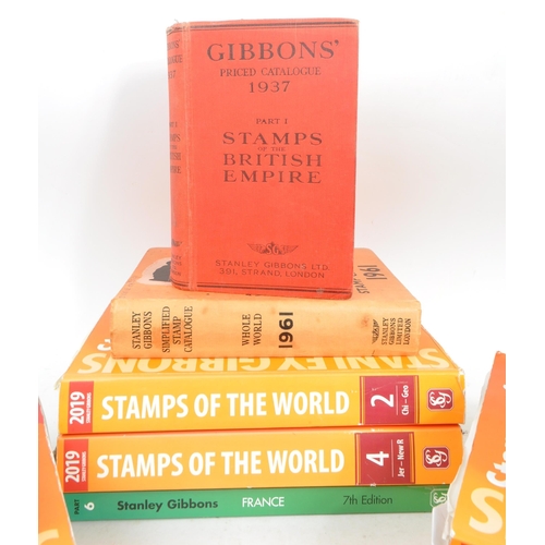 475 - Stanley Gibbons - A collection of thirteen Stanley Gibbons stamp catalogue books to include: 1937 Pr... 