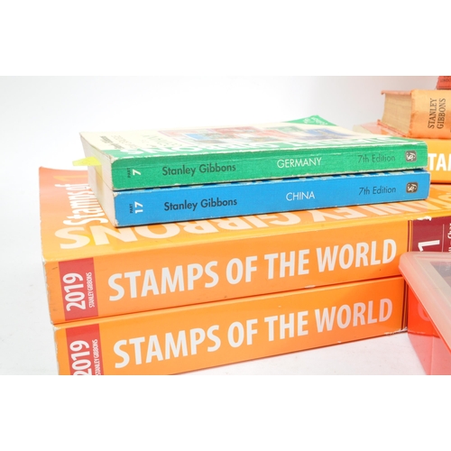 475 - Stanley Gibbons - A collection of thirteen Stanley Gibbons stamp catalogue books to include: 1937 Pr... 