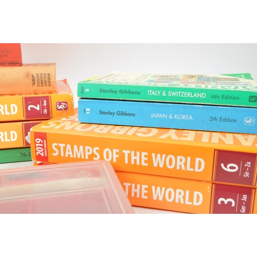 475 - Stanley Gibbons - A collection of thirteen Stanley Gibbons stamp catalogue books to include: 1937 Pr... 