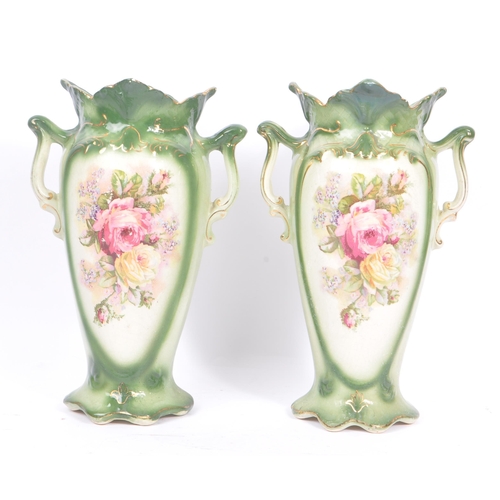 51 - A pair of 19th century amphora ceramic pottery vases. With foliate shaped rims, twin handle, green c... 