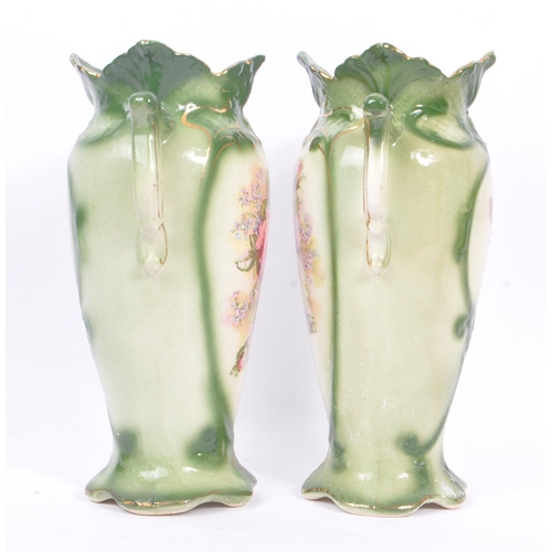 51 - A pair of 19th century amphora ceramic pottery vases. With foliate shaped rims, twin handle, green c... 