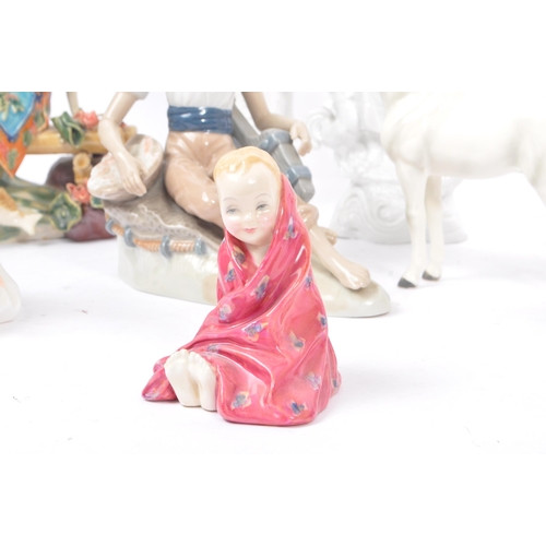 53 - A collection of vintage 20th century porcelain china figurines. To include, ballerinas, clowns, baby... 