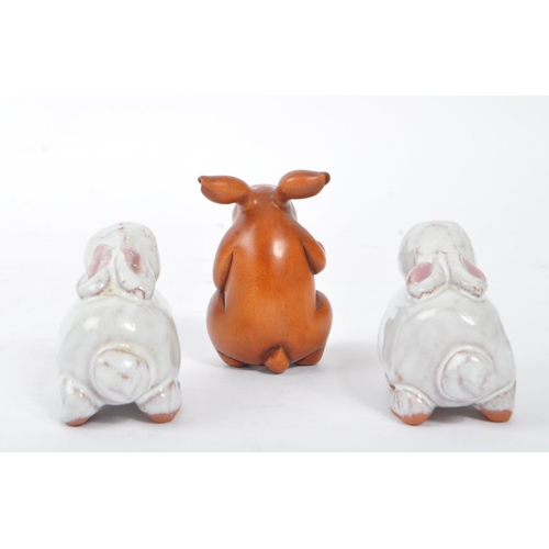 60 - A vintage 20th century Netsuke rabbits sculpture / figures. To include two ceramic examples, and a w... 