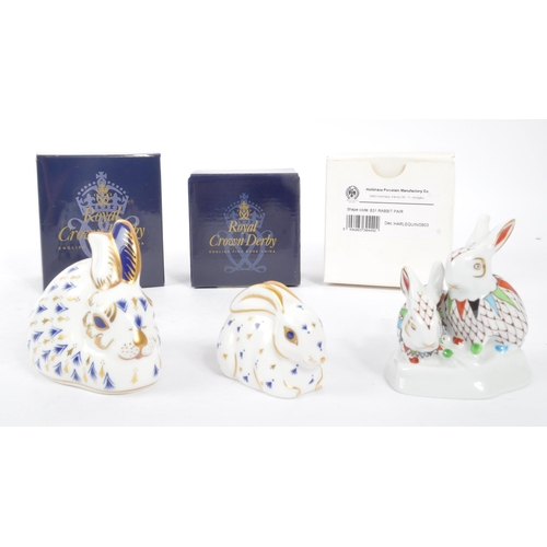 64 - Royal Crown Derby - Two porcelain china rabbit paperweight figures. With stoppers and original boxes... 