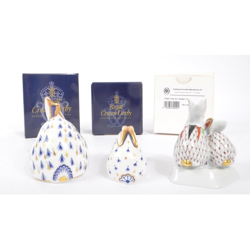 64 - Royal Crown Derby - Two porcelain china rabbit paperweight figures. With stoppers and original boxes... 