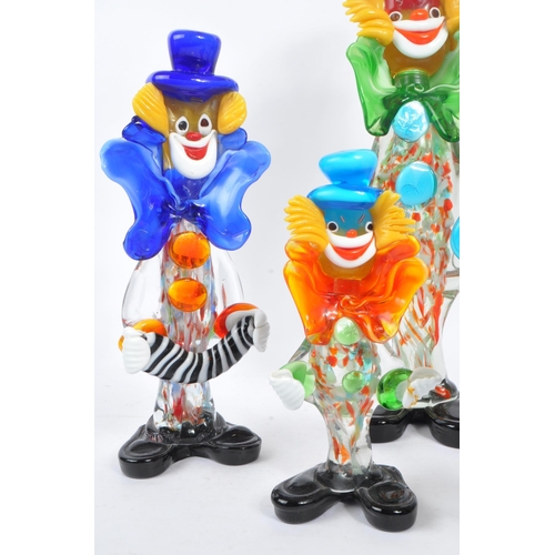 66 - A collection of five studio art glass Murano clown figures. Each on black feet in standing position,... 