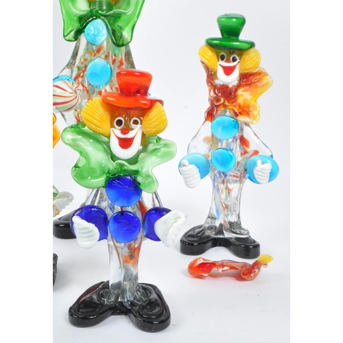 66 - A collection of five studio art glass Murano clown figures. Each on black feet in standing position,... 