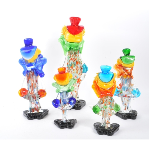 66 - A collection of five studio art glass Murano clown figures. Each on black feet in standing position,... 