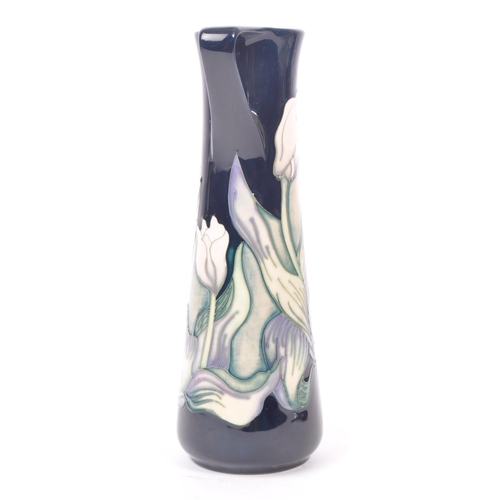 7 - Moorcroft - A china porcelain Moorcroft Pottery vase / jug in snow tulip pattern by Nicola Slaney. D... 