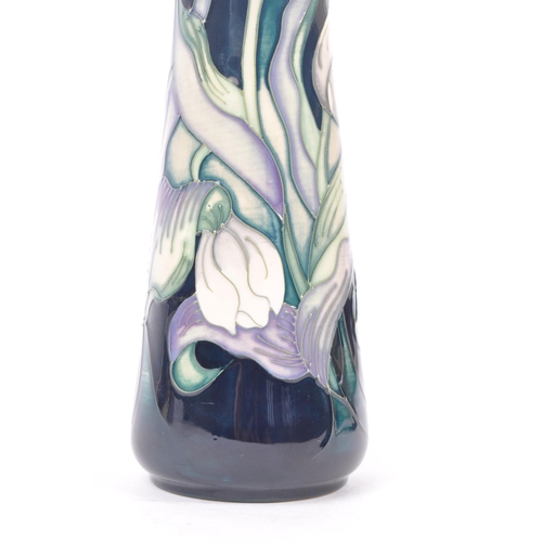 7 - Moorcroft - A china porcelain Moorcroft Pottery vase / jug in snow tulip pattern by Nicola Slaney. D... 