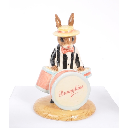 77 - Royal Doulton - Bunnykins - A collection of porcelain china bunny figurines / statues. Comprising of... 