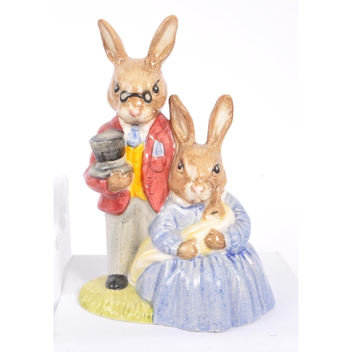 77 - Royal Doulton - Bunnykins - A collection of porcelain china bunny figurines / statues. Comprising of... 