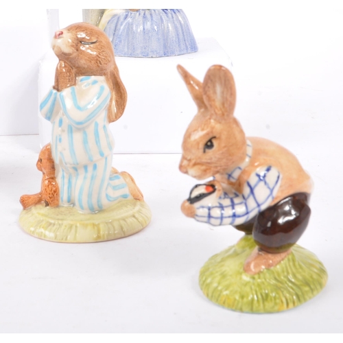 77 - Royal Doulton - Bunnykins - A collection of porcelain china bunny figurines / statues. Comprising of... 