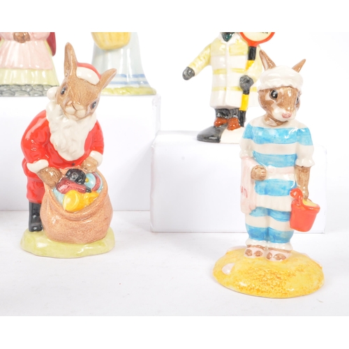 79 - Royal Doulton - Bunnykins - A collection of porcelain china bunny figurines / statues. Comprising of... 