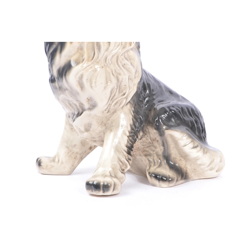 9 - A vintage mid 20th century circa 1960s ceramic pottery figure of a dog. Rough collie breed, in a sea... 