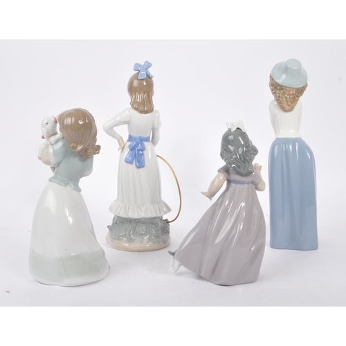 90 - Nao - A collection of four china porcelain Nao figures to include young girl with puppy, young girl ... 