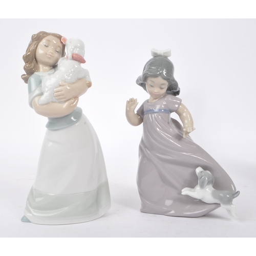 90 - Nao - A collection of four china porcelain Nao figures to include young girl with puppy, young girl ... 