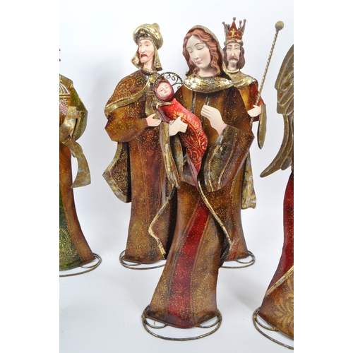 317 - A collection of religious figures ornaments Christmas decorations. To include some members of the Na... 